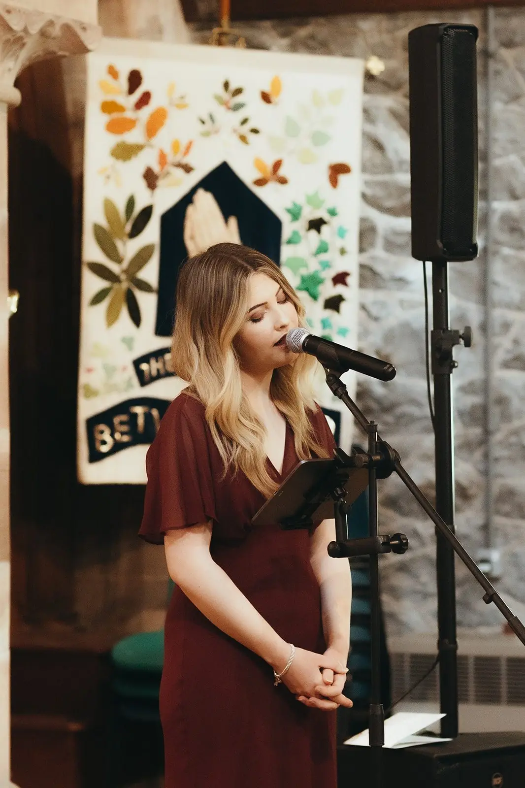 Jenny Jones singing at a wedding ceremony in church